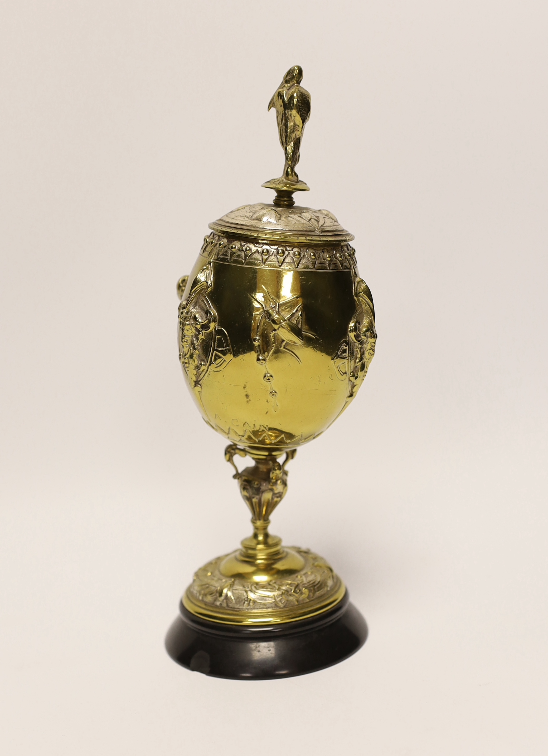 A brass and plated goblet and cover raised on circular slate base, body signed A Cain, 25cm high